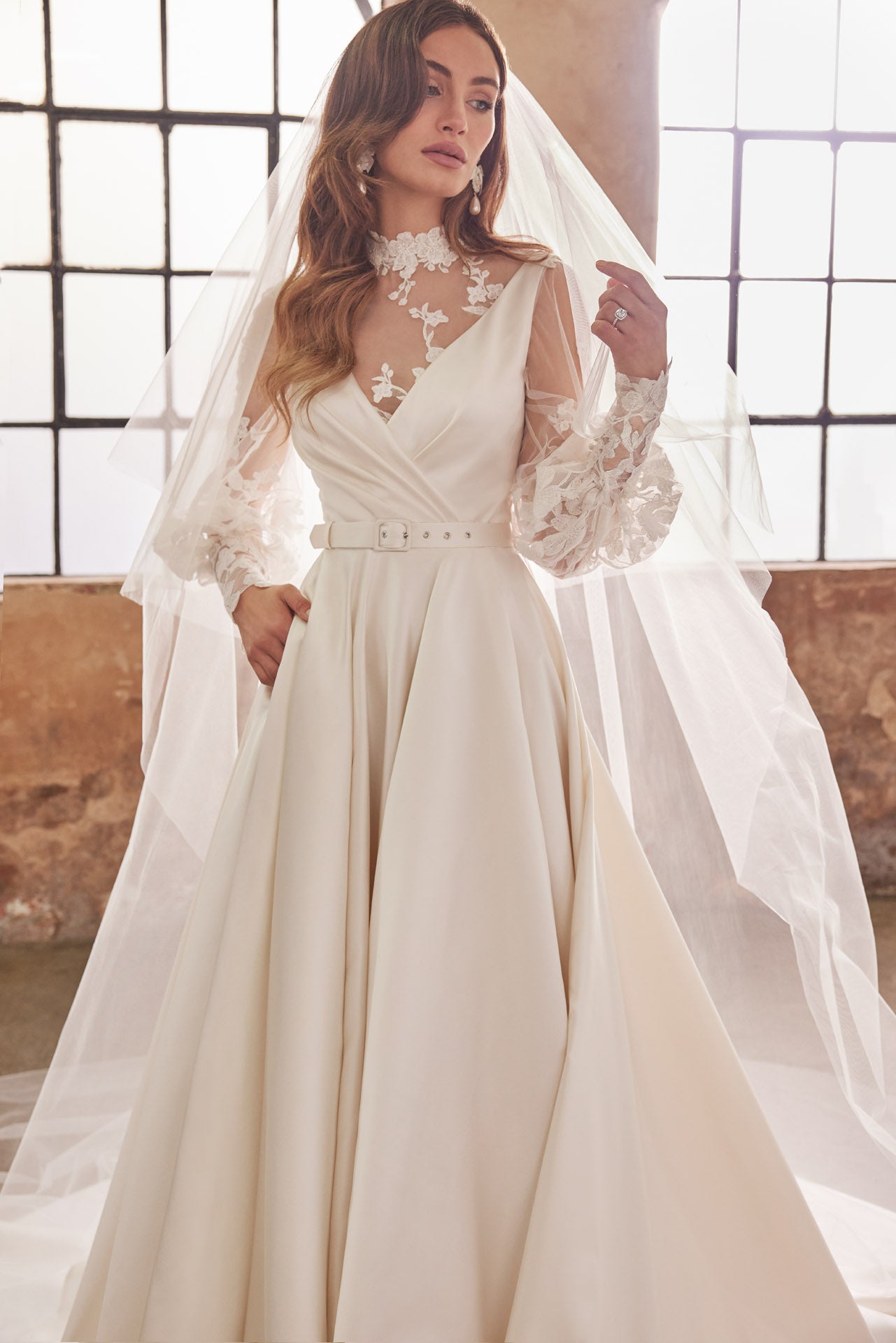 Full skirted a-line gown with flattering neckline, detachable belt and bow. Sumptuous satin with inner corset, full circle skirt with concealed pockets.