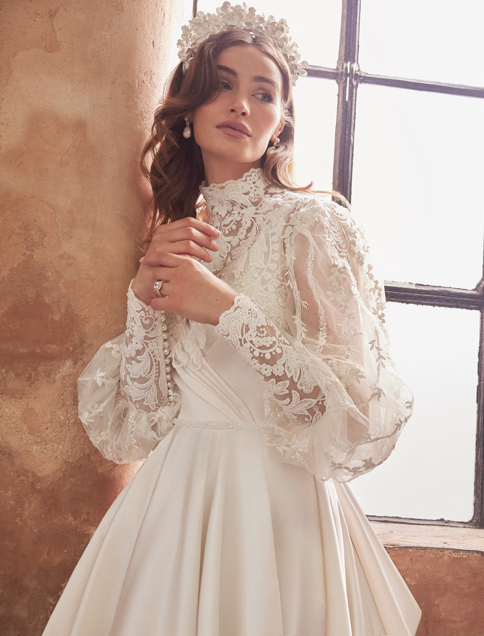 Full skirted a-line gown with flattering neckline, detachable belt and bow. Sumptuous satin with inner corset, full circle skirt with concealed pockets.