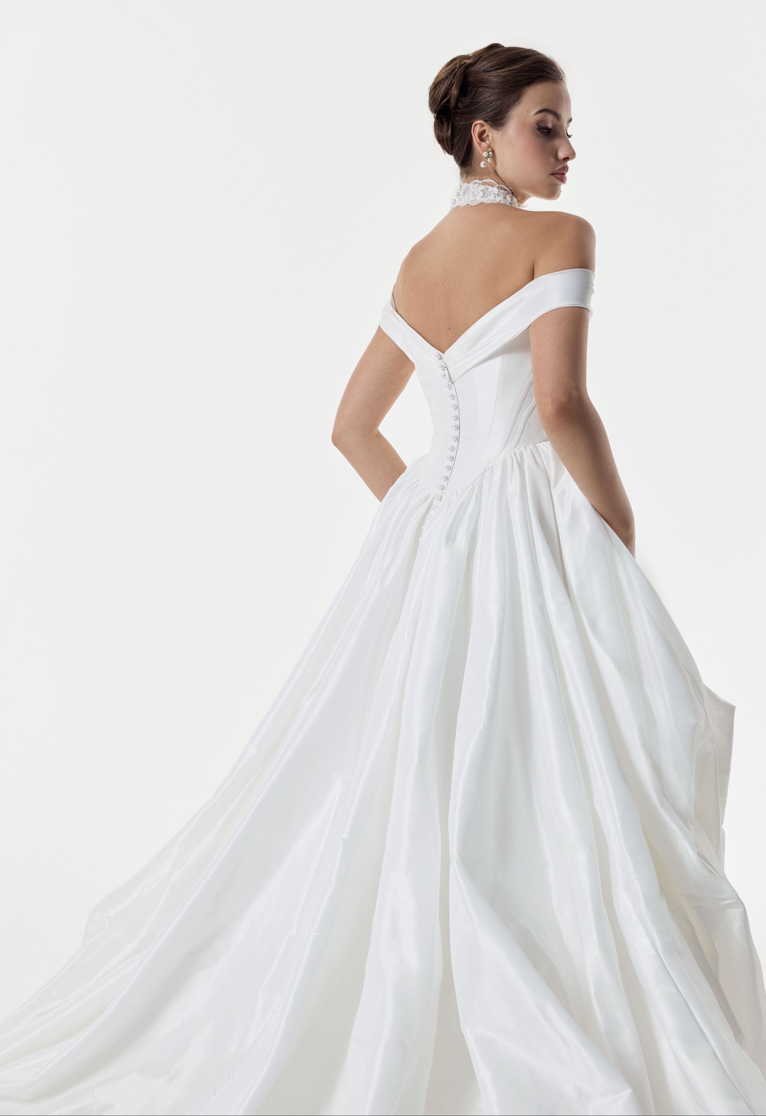 classic ivory bardot neckline and corset basque waist and ruched pick-up skirt leg slit detailing