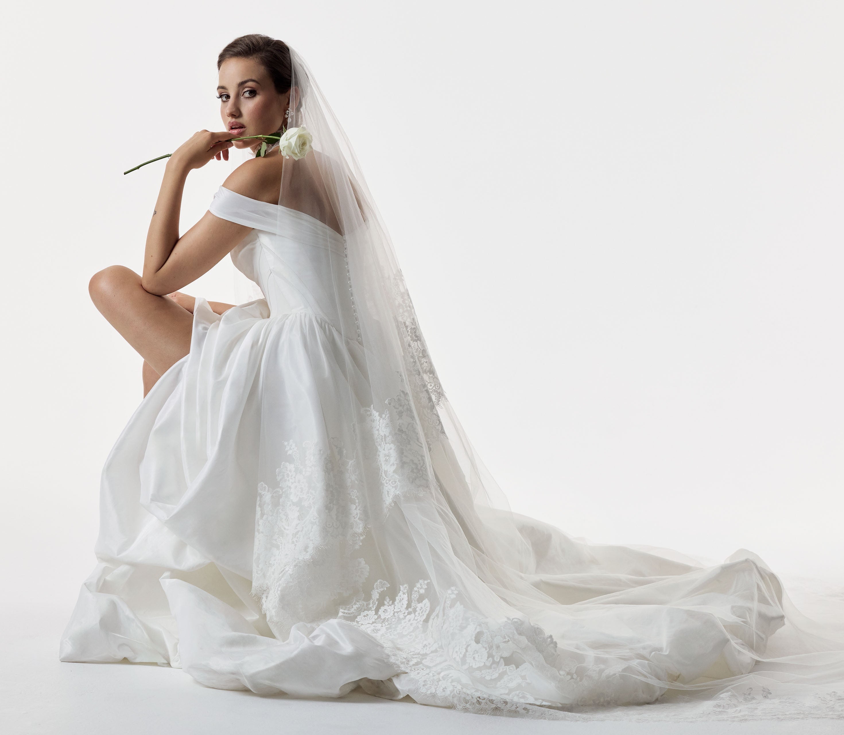 classic ivory bardot neckline and corset basque waist and ruched pick-up skirt leg slit detailing