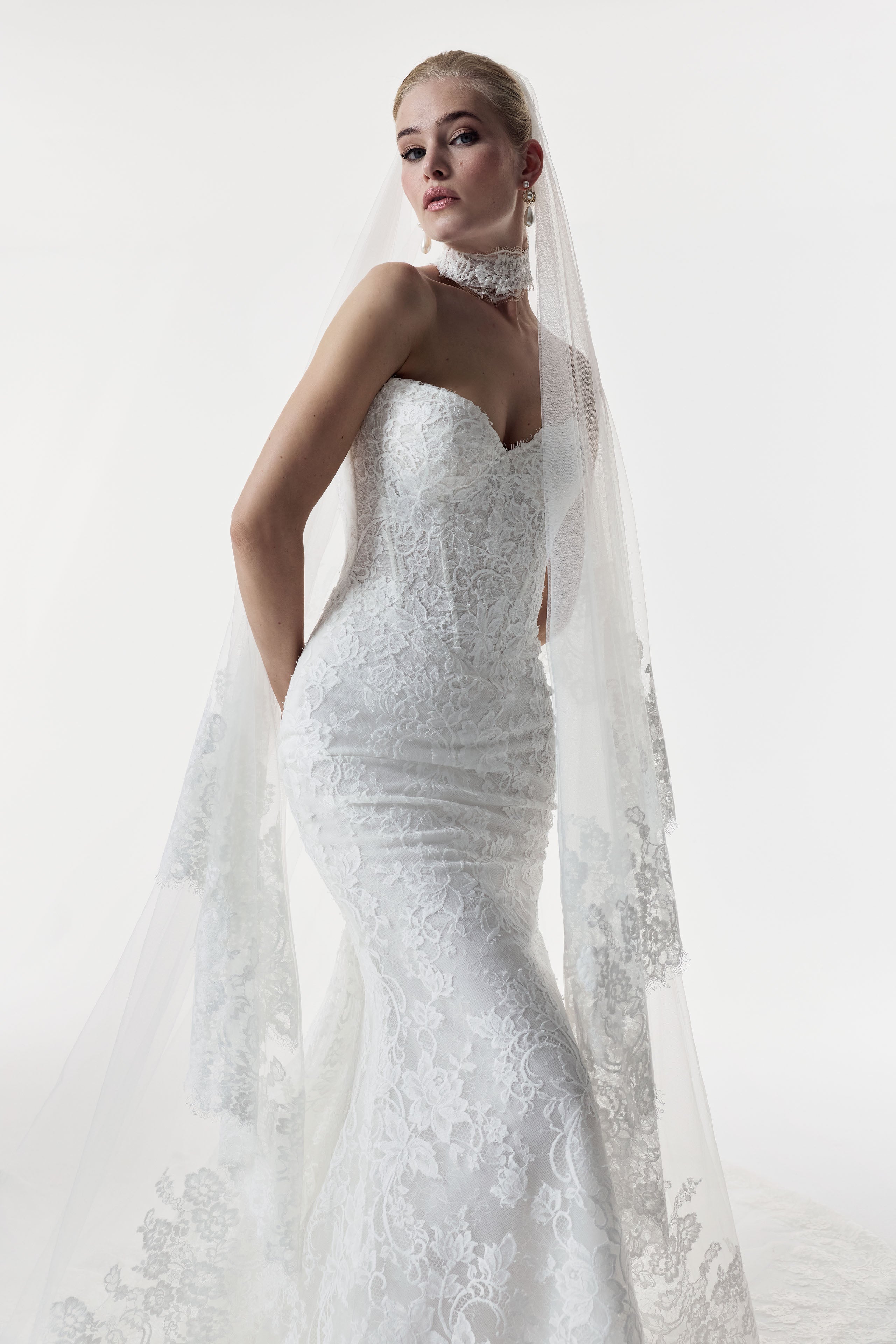 sweetheart neckline and fitted strapless Chantilly lace bodice with basque waist with lace choker and veil