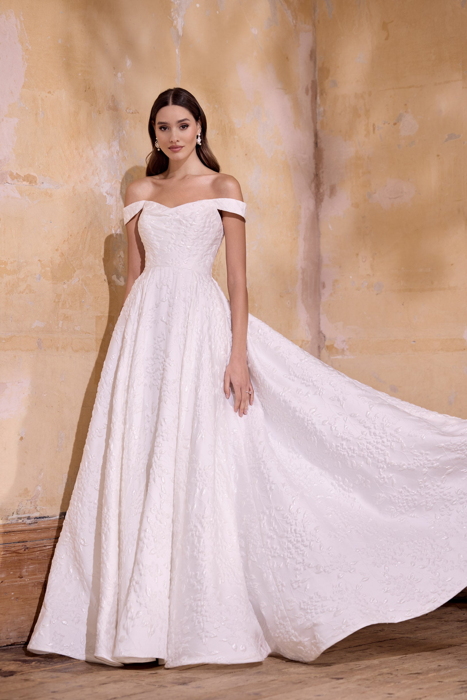 off the shoulder lux embossed silk jacquard with a draped bodice inner corset and full A-line skirt with pearl buttons and detachable straps
