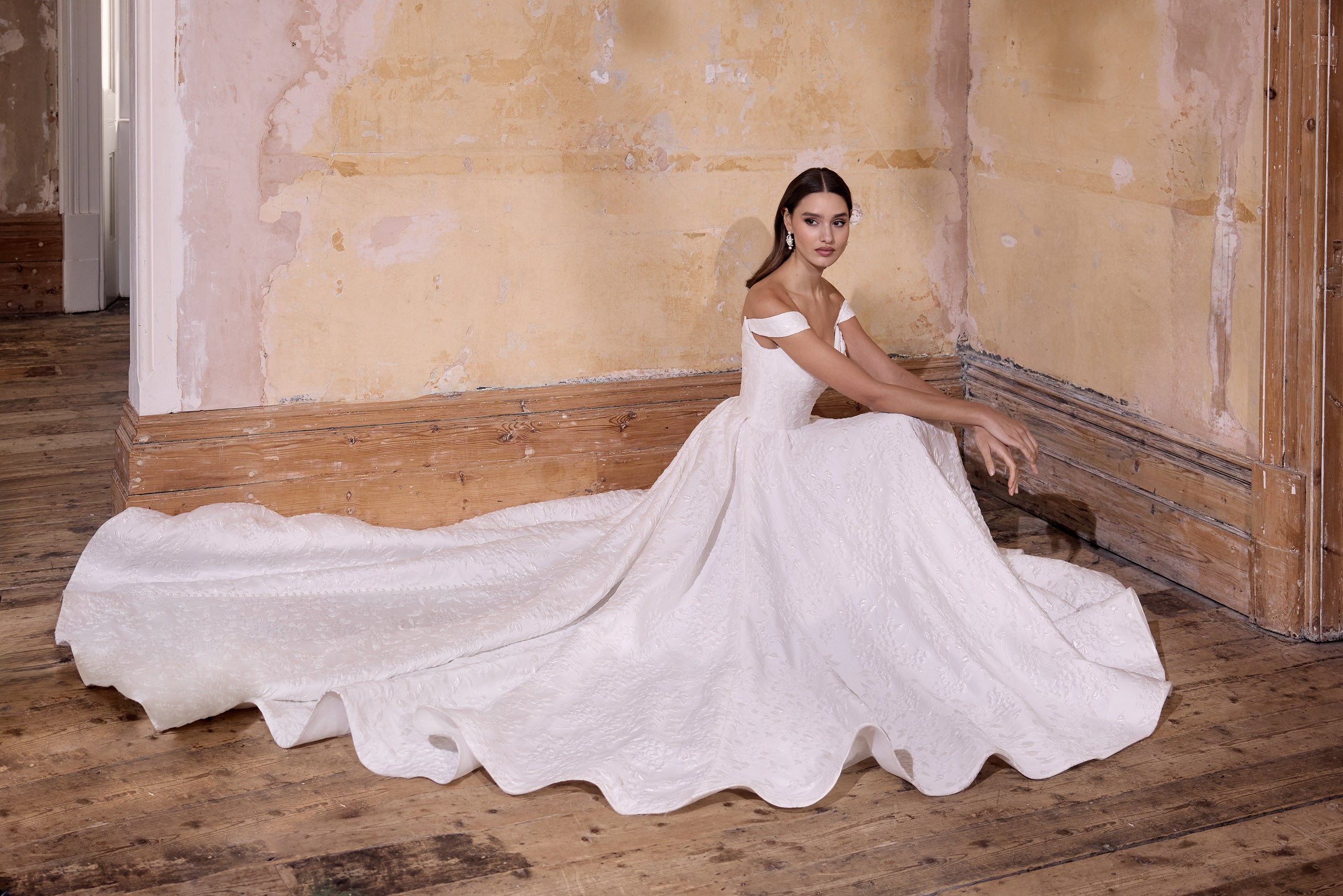 off the shoulder lux embossed silk jacquard with a draped bodice inner corset and full A-line skirt with pearl buttons and detachable straps