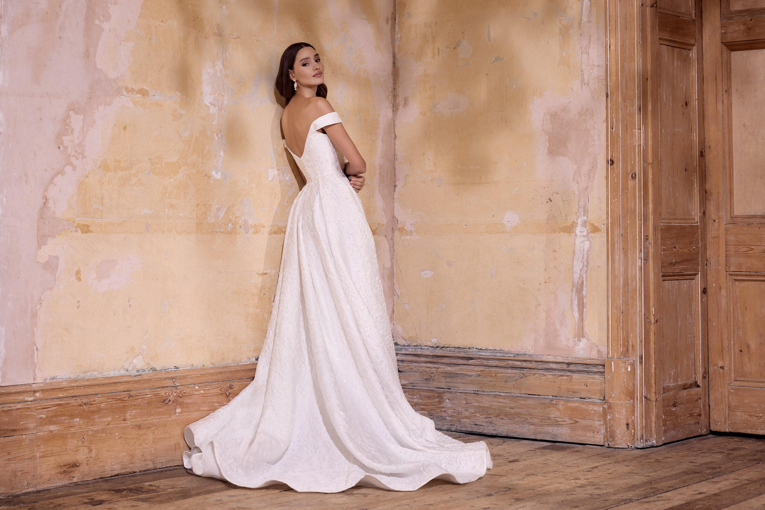 off the shoulder lux embossed silk jacquard with a draped bodice inner corset and full A-line skirt with pearl buttons and detachable straps