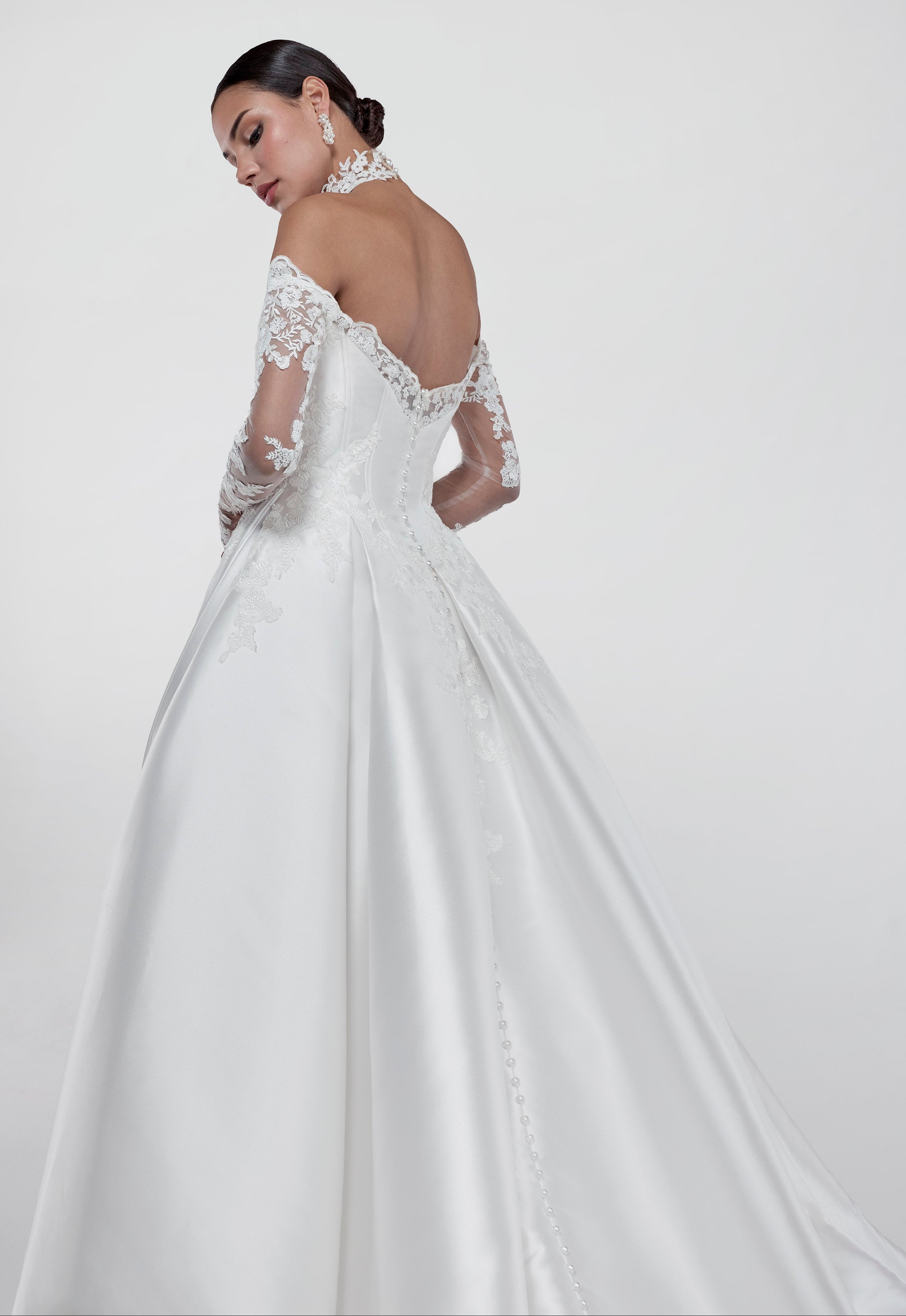 ruched lace applique sweetheart neckline with a draped bust and silk Mikado corset and A-line skirt and lace sleeves