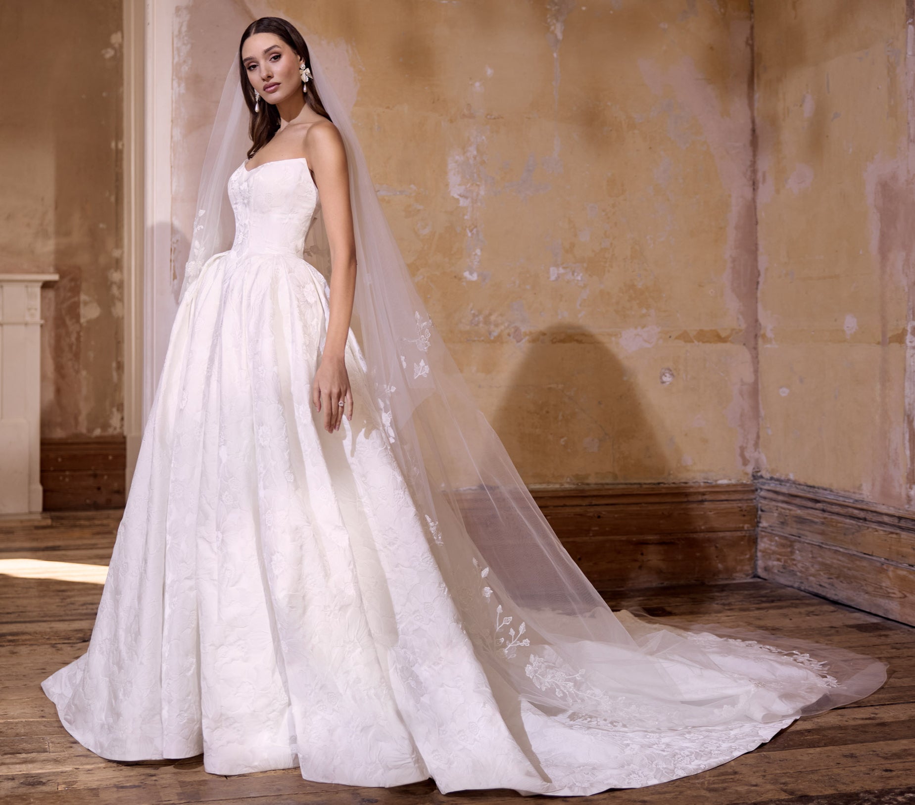 strapless scoop neckline embossed jacquard ballgown silhouette with dramatic train with lace wedding veil