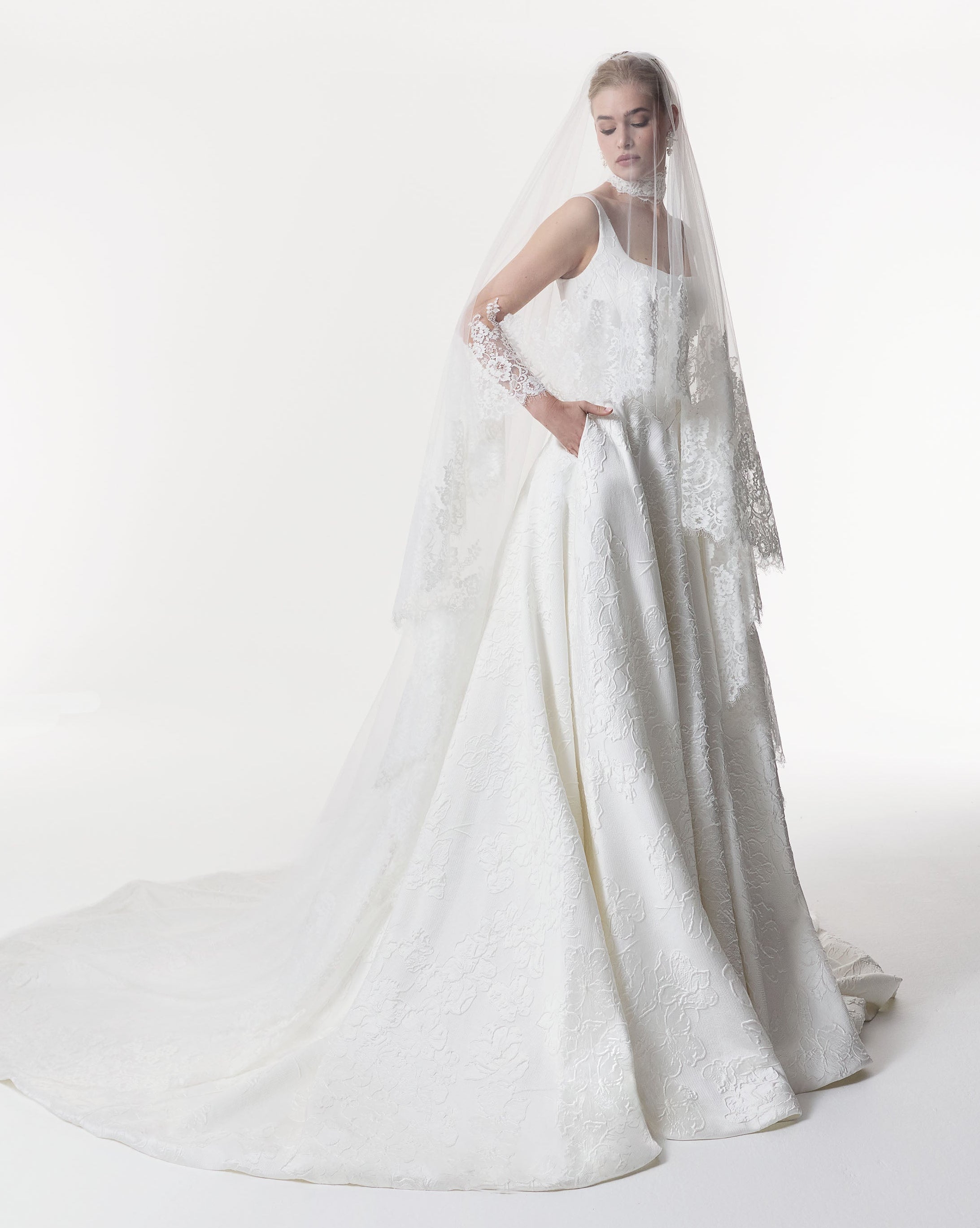 square neckline with basque waist A-Line skirt in silk embossed jacquard with lace choker and veil
