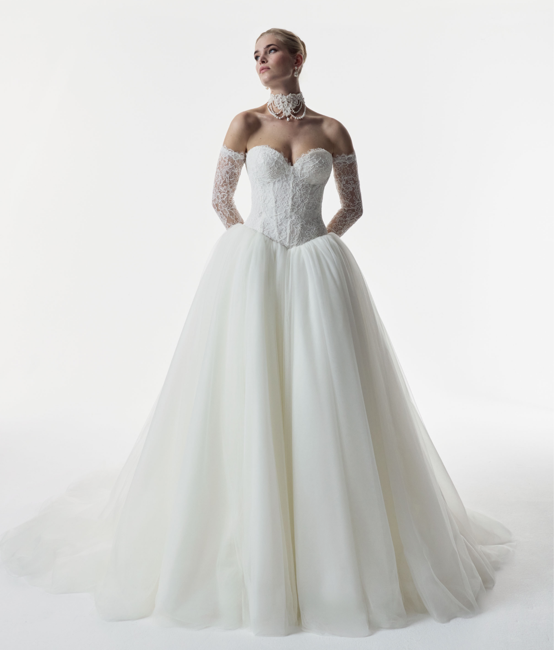 strapless sweetheart neckline corset basque waist bodice in corded French lace and full ballgown skirt in soft tulle with matching sleeves and choker