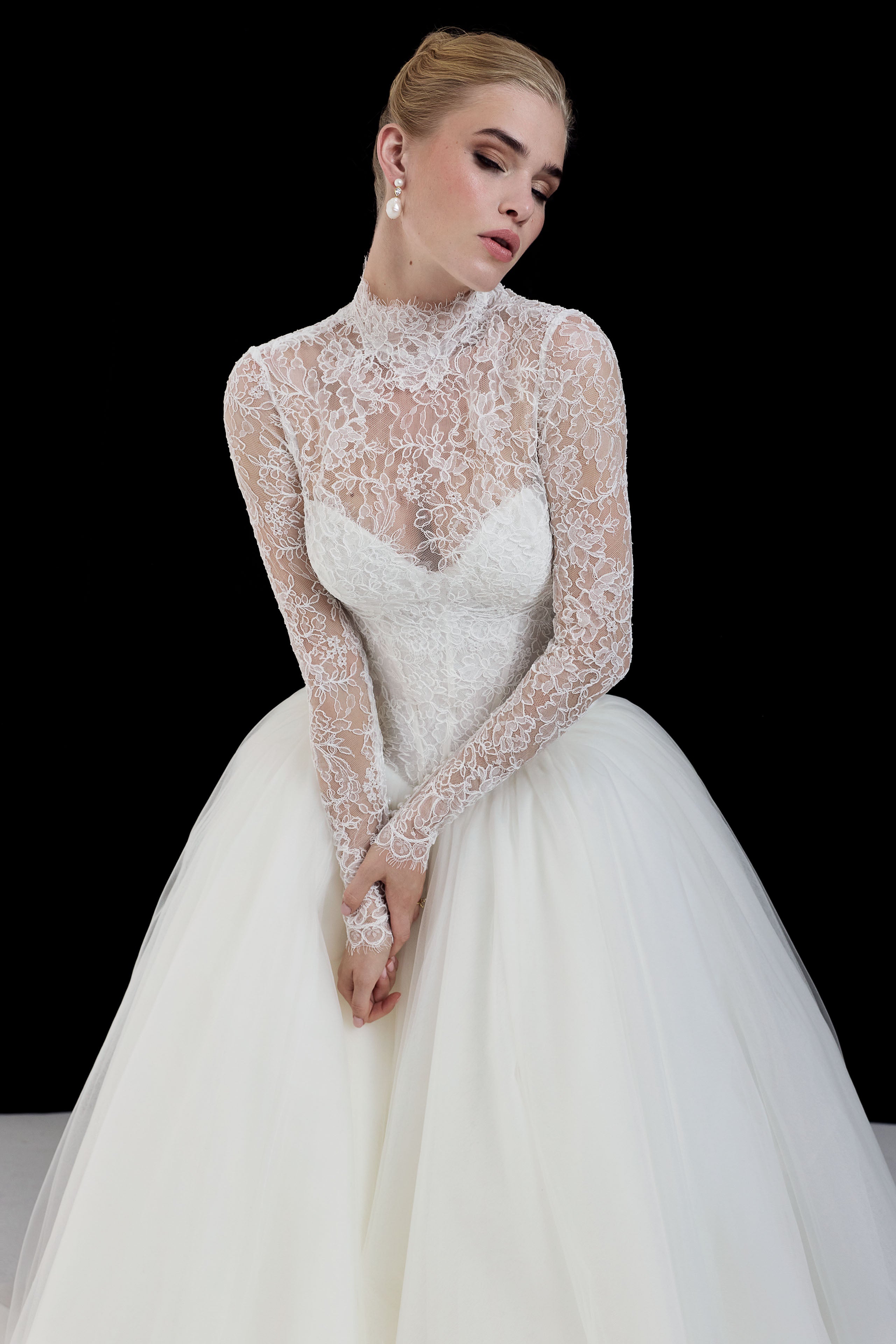 strapless sweetheart neckline corset basque waist bodice in corded French lace and full ballgown skirt in soft tulle with matching high neck lace sleeve topper