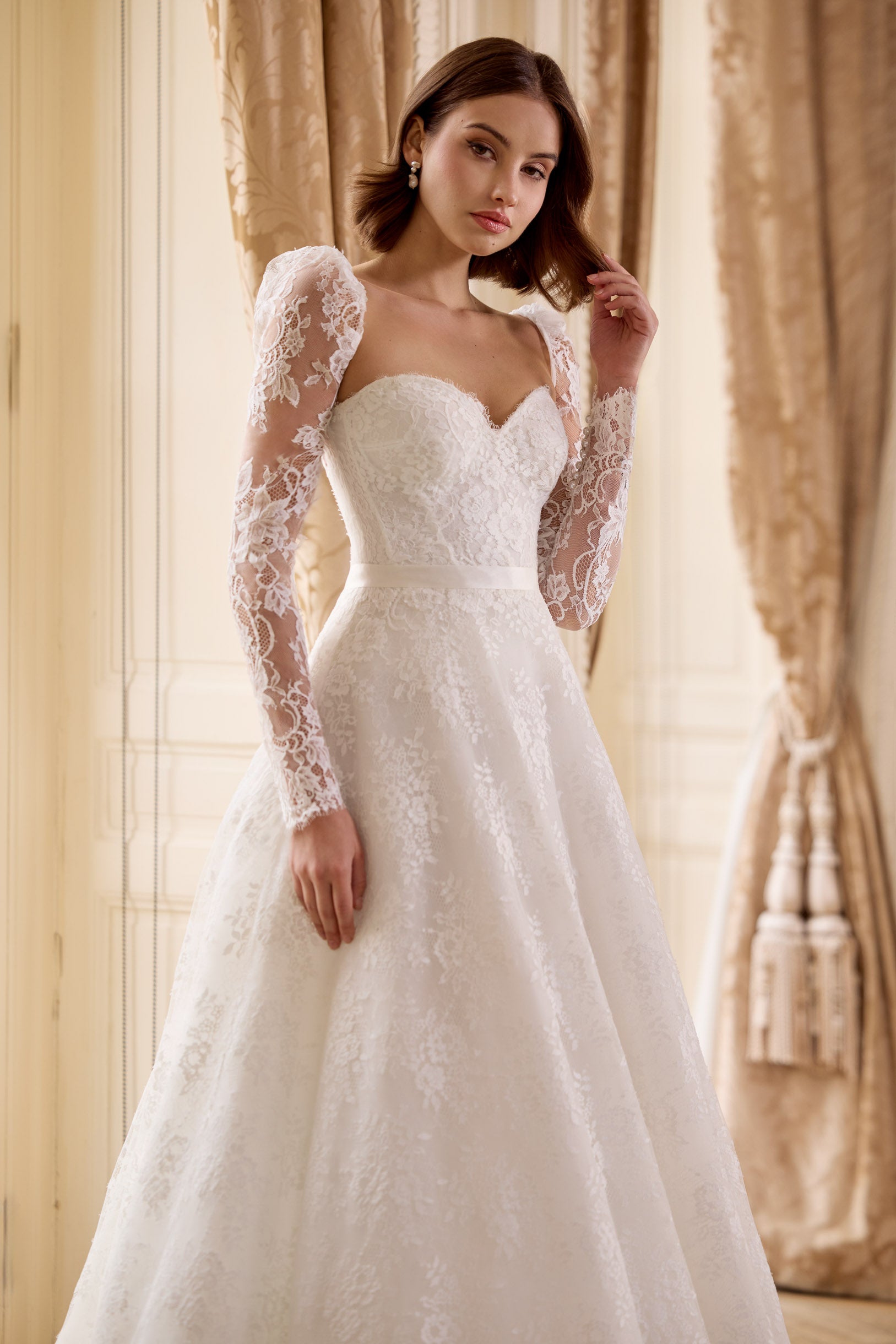 strapless French Chantilly A-line gown with intricate pearl button