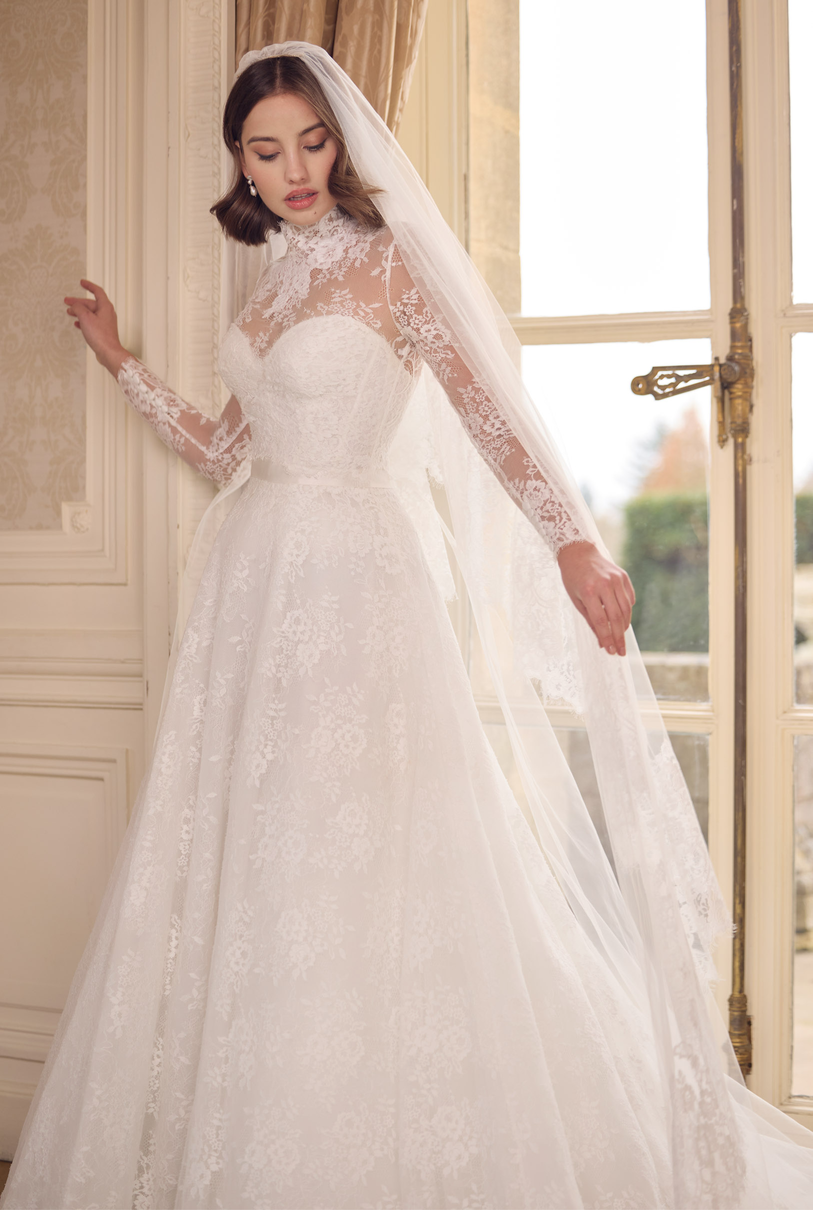 strapless French Chantilly A-line gown with intricate pearl button