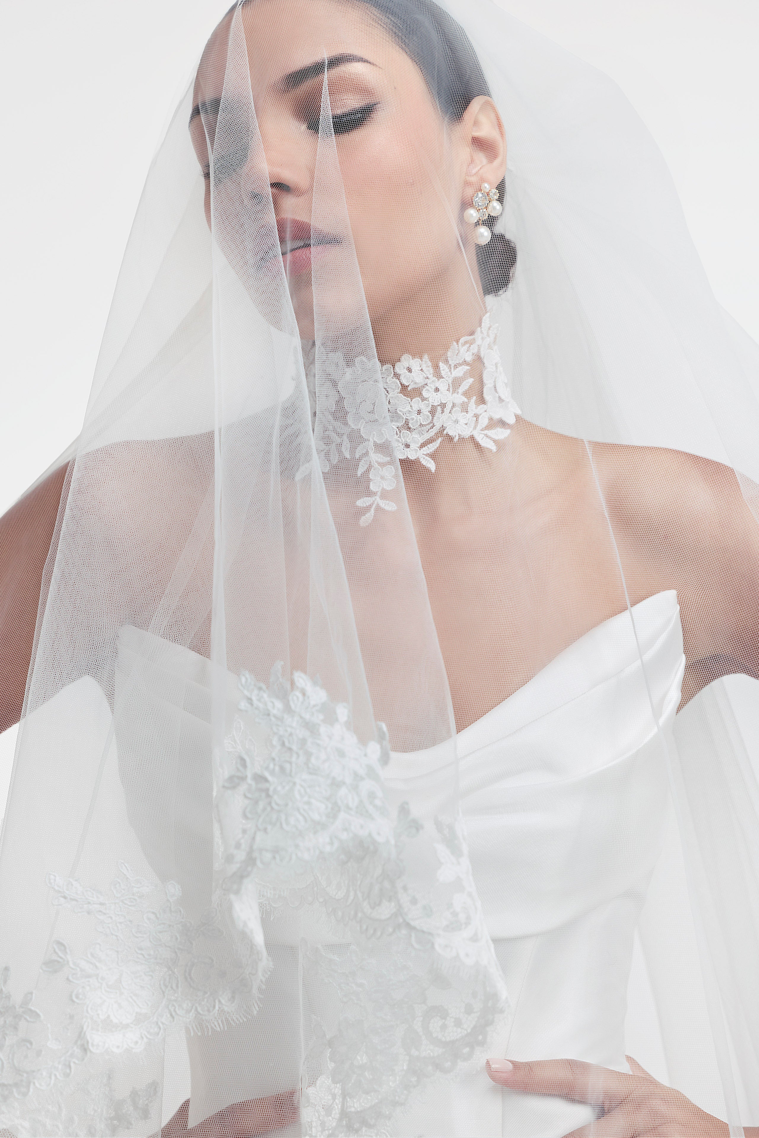 silk Mikado swoop neckline with a basque waist and pleated skirt