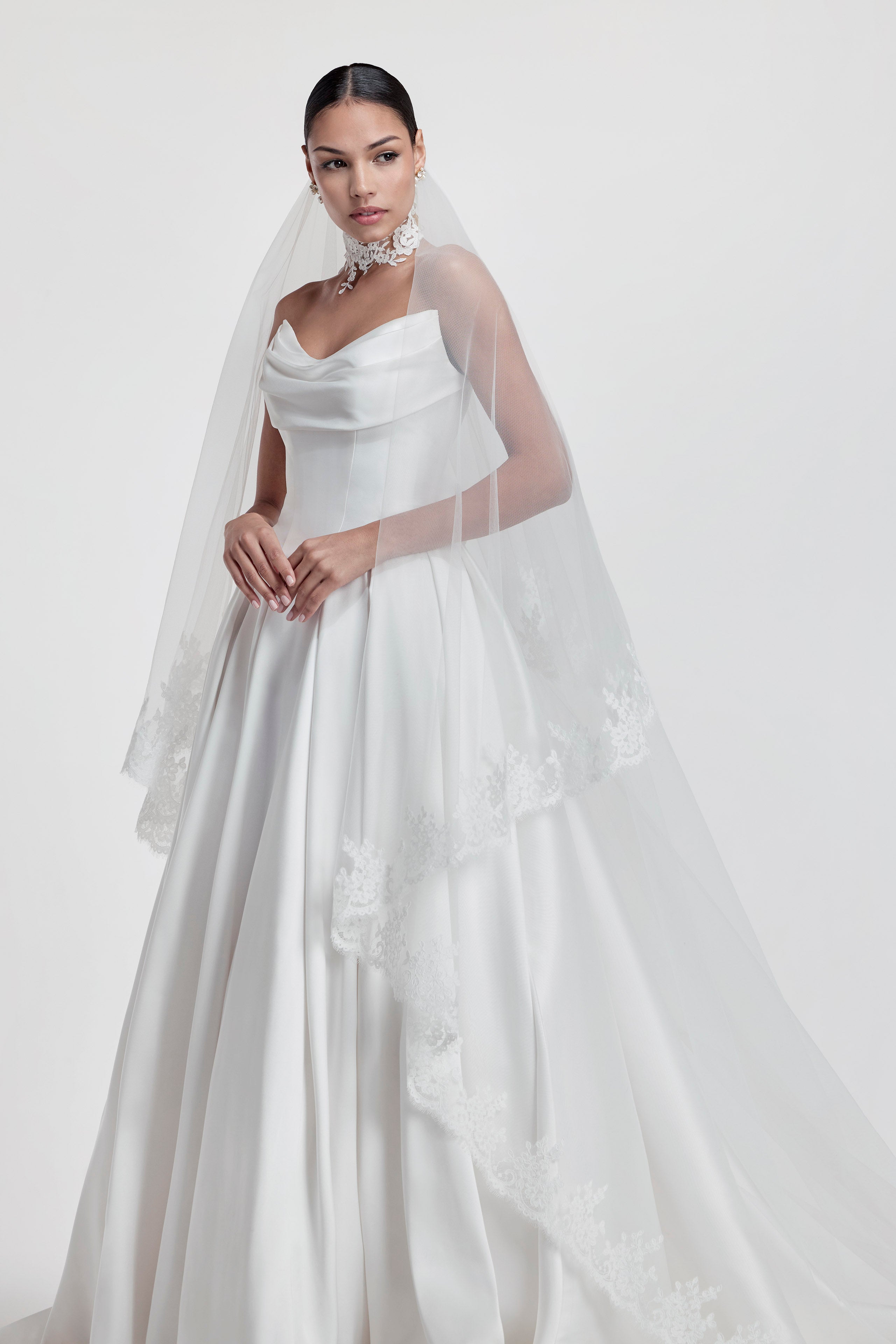 silk Mikado swoop neckline with a basque waist and pleated skirt