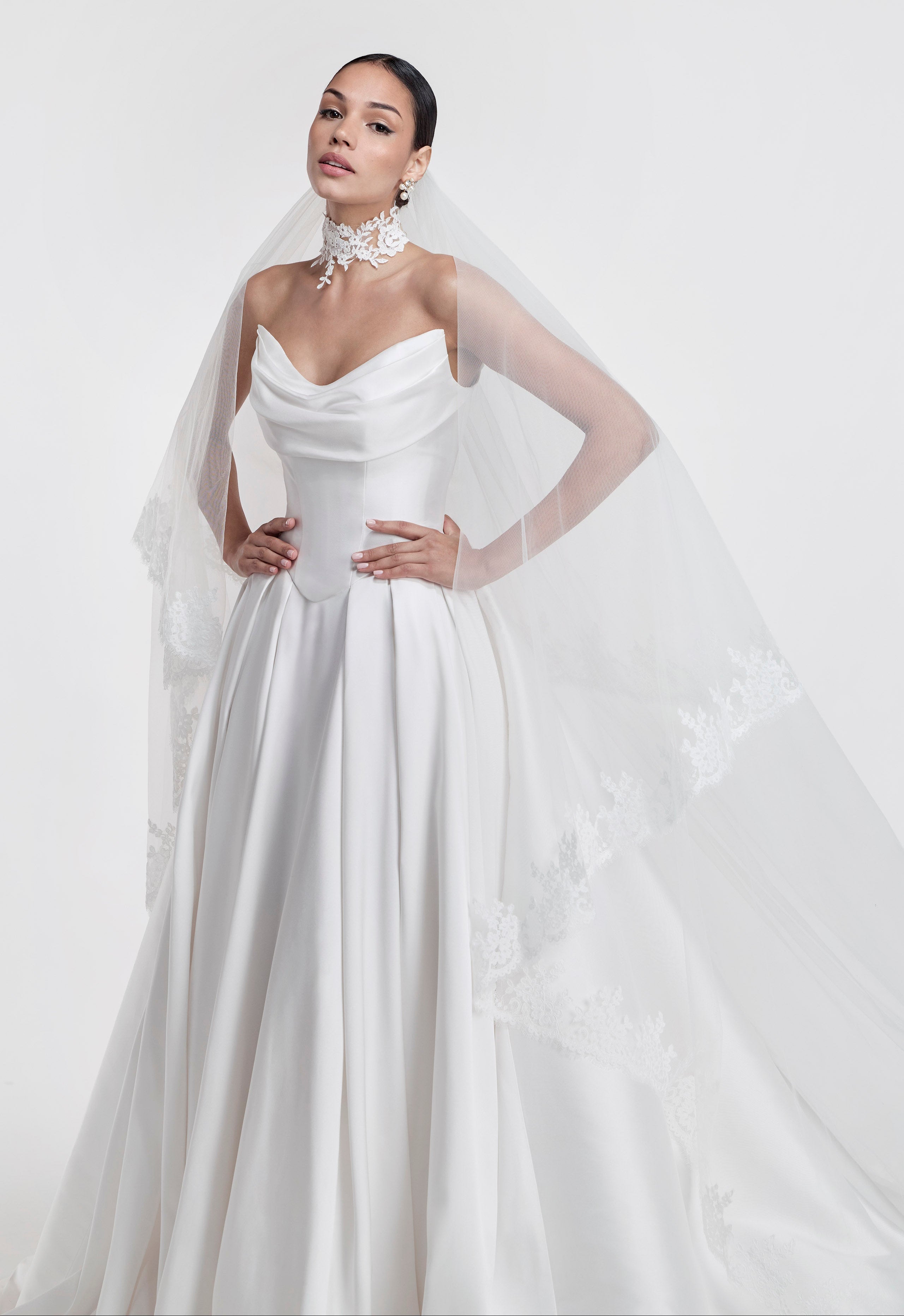 silk Mikado swoop neckline with a basque waist and pleated skirt