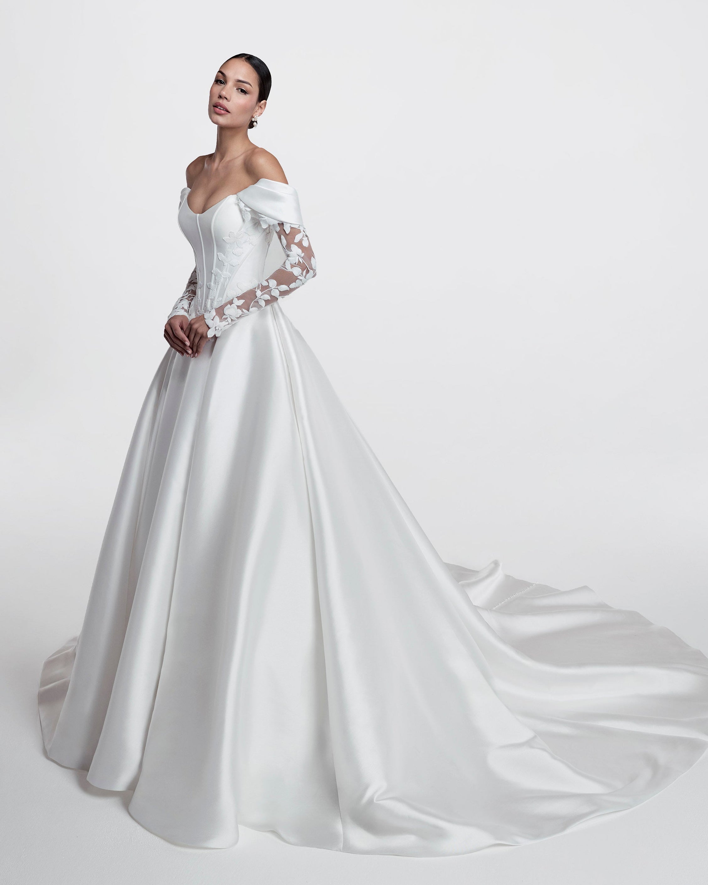 Strapless cat eye neckline with V basque dropped waist corset and A-line skirt with floral embroidered lace applique with detachable straps and lace sleeves